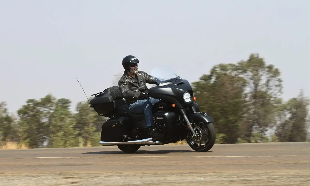 Indian Roadmaster 116 Dark Horse_ Check out that antenna fighting against the wind force, but the rider is comfy in an open face lid