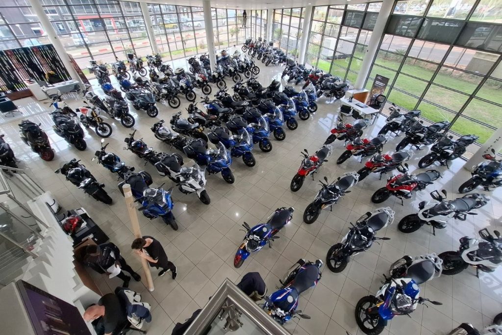 BMW Motorrad GS adventure bike in South Africa BMW R 1300 GS Adventure touring motorcycle BMW F 900 GS Adventure on a dirt road BMW Motorrad dealership showroom in South Africa Riding gear and helmet display at BMW Motorrad store