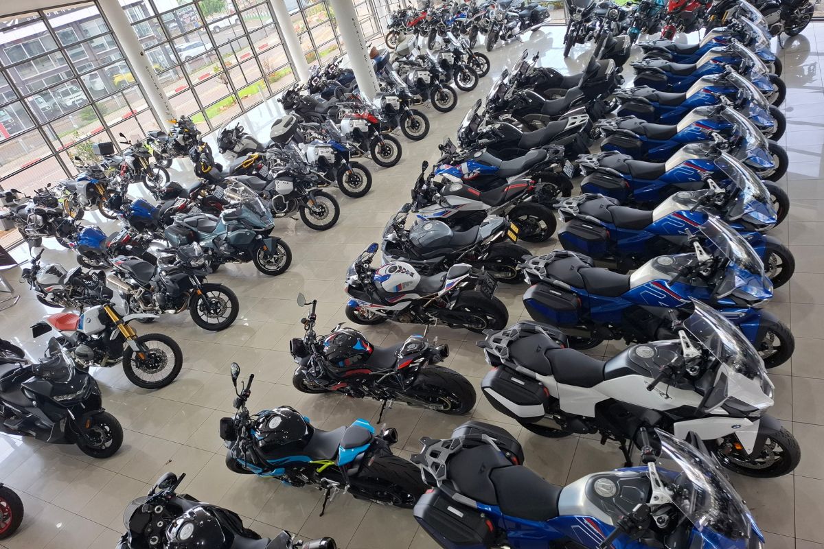 BMW Motorrad GS adventure bike in South Africa BMW R 1300 GS Adventure touring motorcycle BMW F 900 GS Adventure on a dirt road BMW Motorrad dealership showroom in South Africa Riding gear and helmet display at BMW Motorrad store
